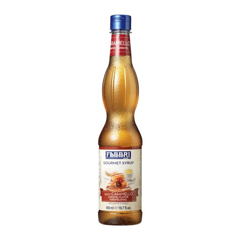 Auksinės spalvos karamelės sirupas stiklainyje
