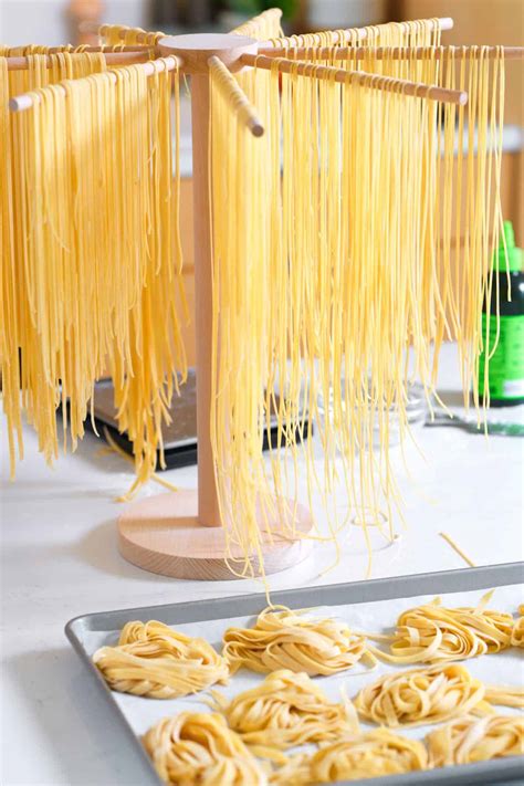 Homemade oat pasta drying on a rack