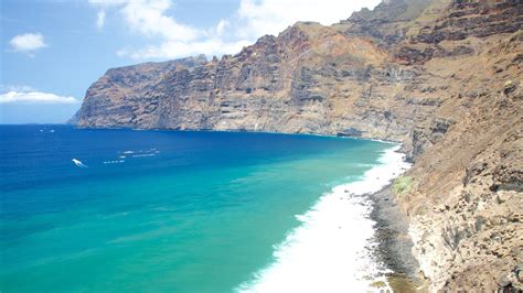 Los Gigantes uolos saulėlydžio metu