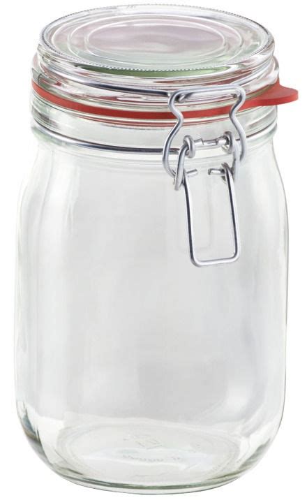 Stiklainis su akacijų medumi ir akacijos šakelė