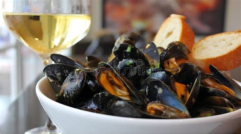 Mussels with crusty bread and a glass of white wine