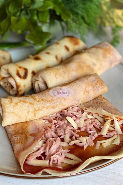 Lietiniai blynai su sūriu, paruošti kepimui orkaitėje