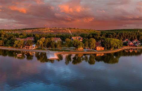 Saulėlydis virš Kuršių nerijos nuo SKY21 terasos